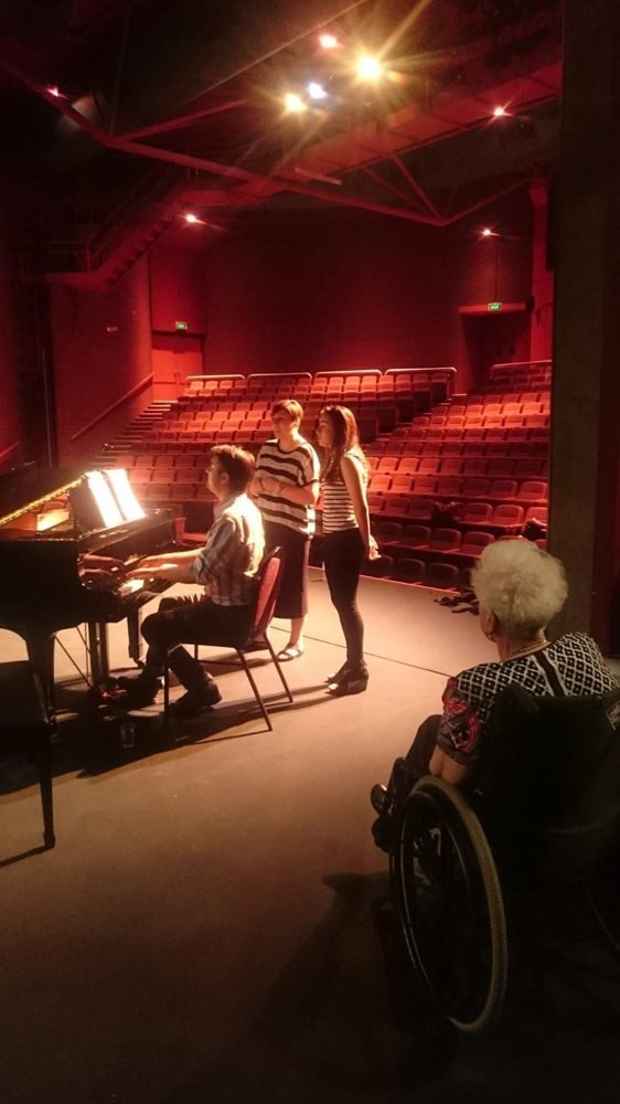 Steven Bailey at the piano in a theatre