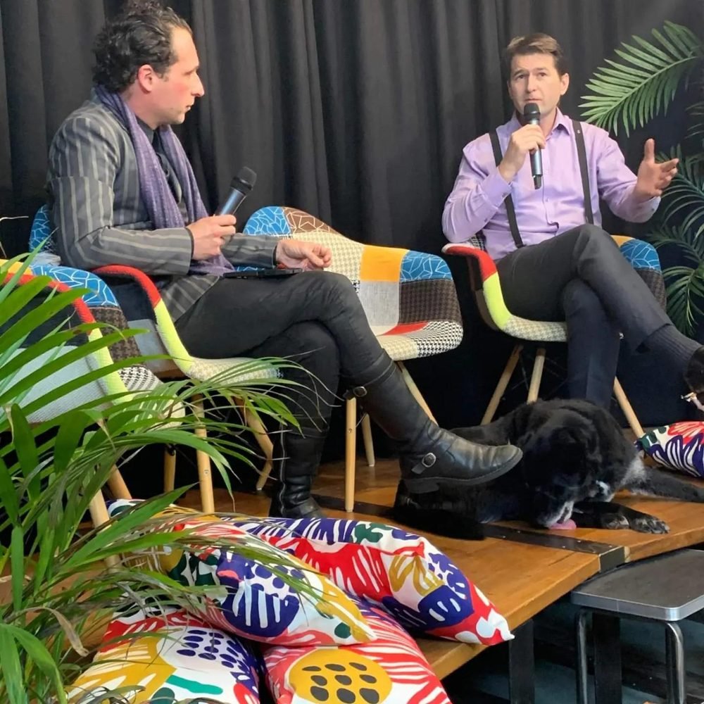 Steven Bailey speaking on stage in a panel conversation