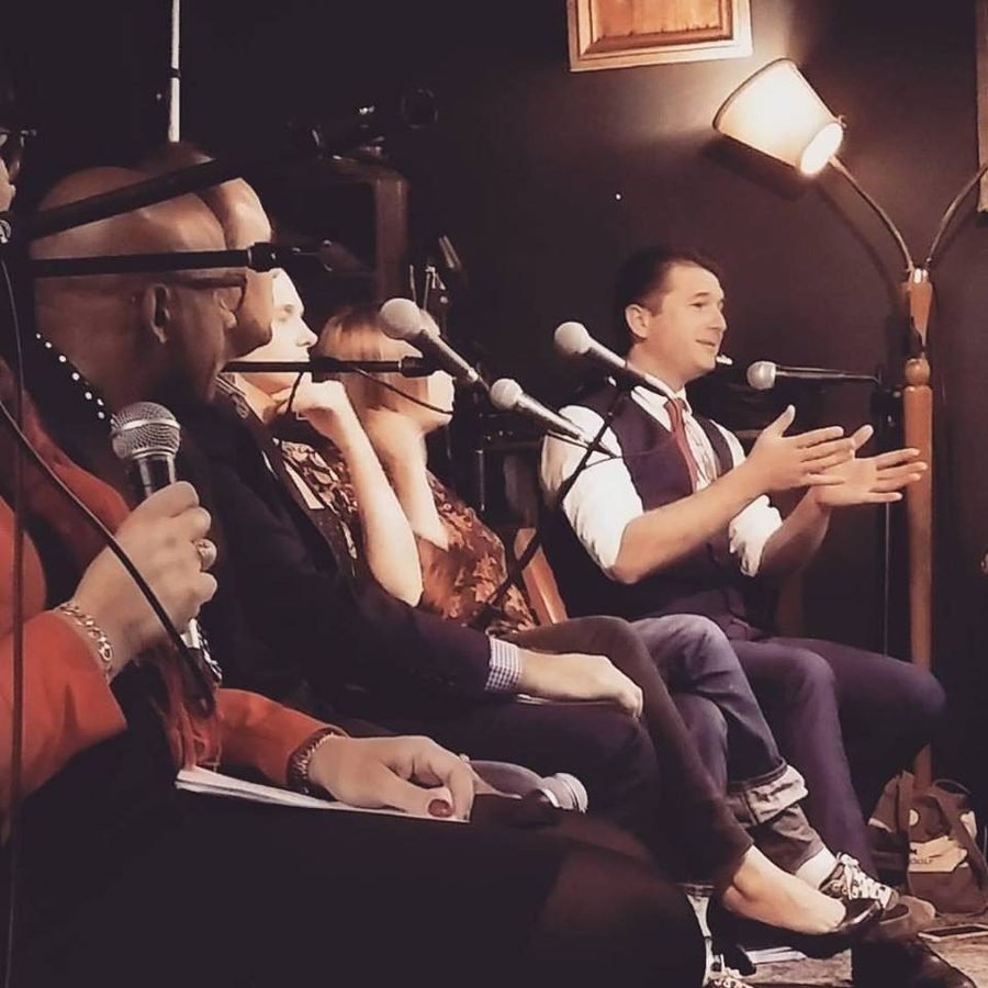 Steven Bailey speaking into a microphone on a panel